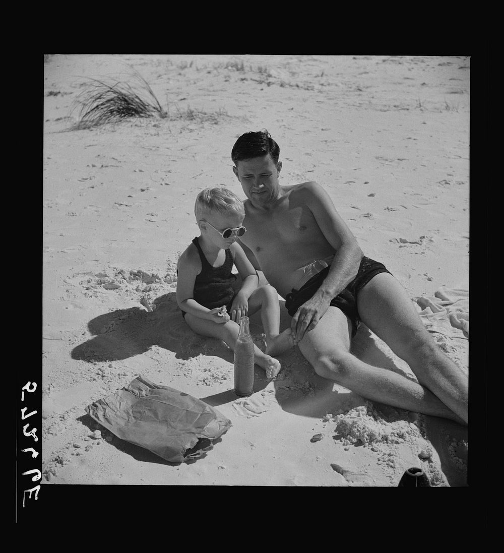 [Untitled photo, possibly related to: Guest of Sarasota trailer park, Sarasota, Florida, with his family, picnicking at the…