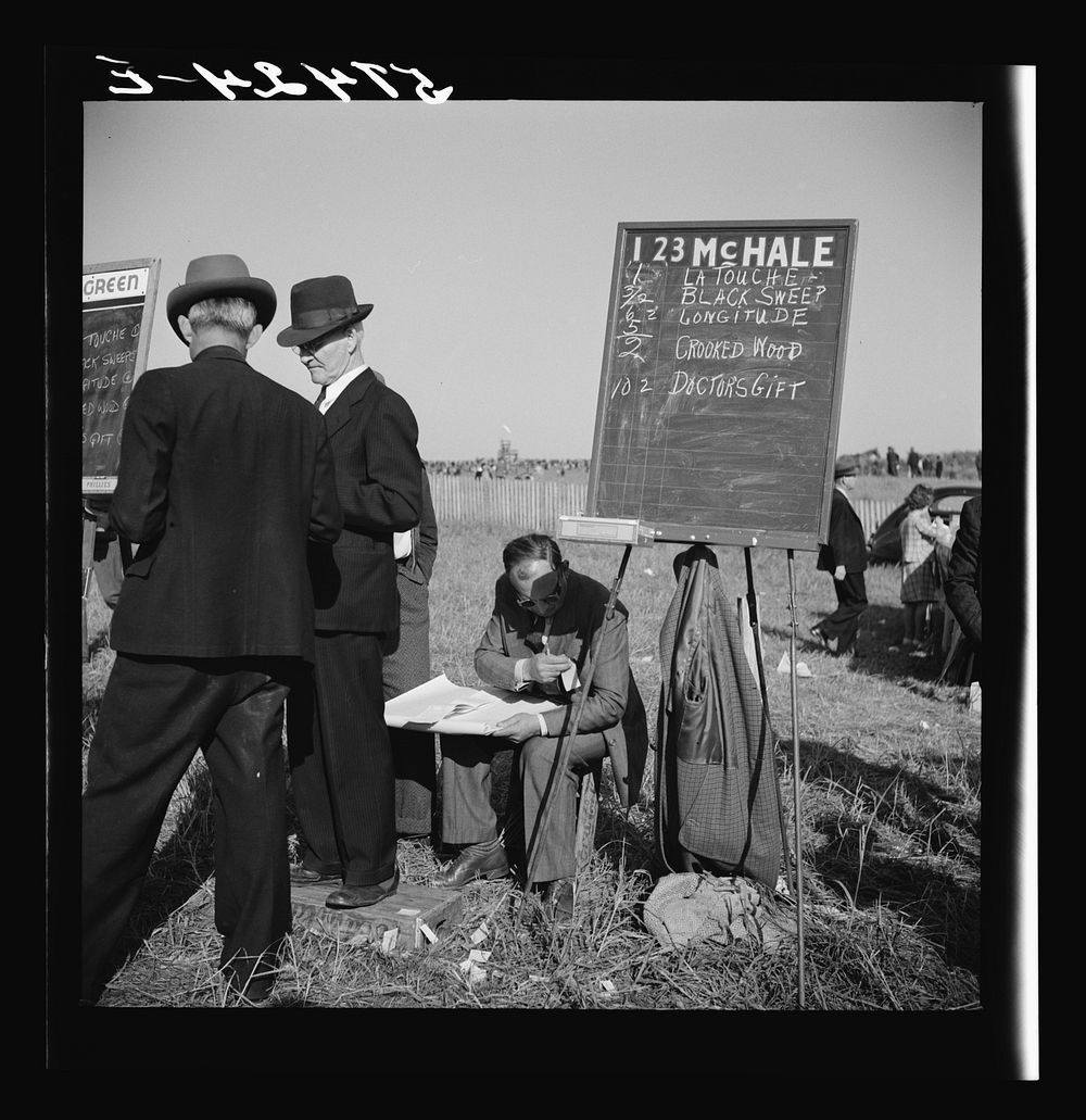 [Untitled photo, possibly related to: Bookies taking bets at horse races. Warrenton, Virginia]. Sourced from the Library of…