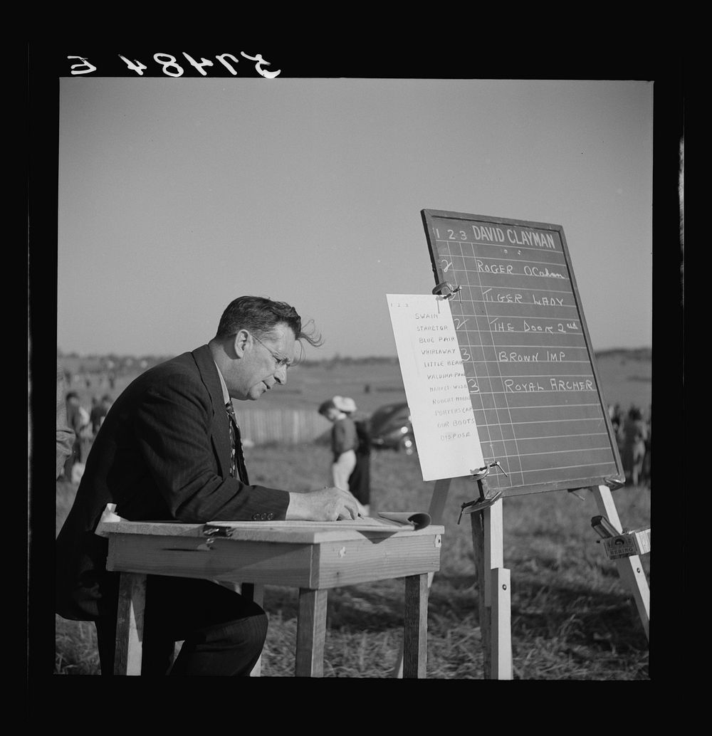 [Untitled photo, possibly related to: Bookies taking bets at horse races. Warrenton, Virginia]. Sourced from the Library of…