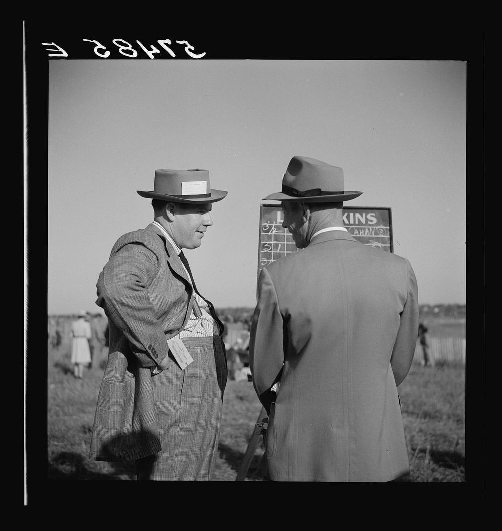 [Untitled photo, possibly related to: Bookies taking bets at horse races. Warrenton, Virginia]. Sourced from the Library of…
