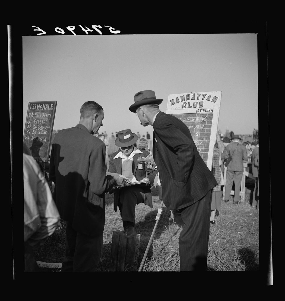 Bookies taking bets at horse races. Warrenton, Virginia. Sourced from the Library of Congress.