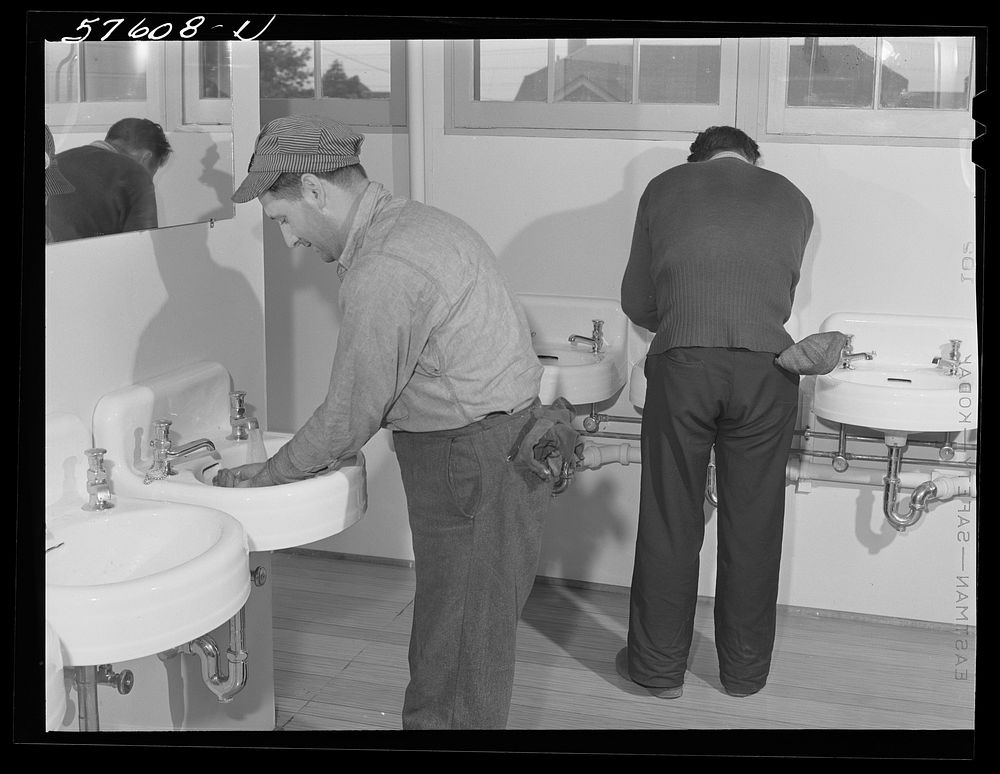 Workers from electric boat company plant in washroom of new dormitories for defense workers. Groton, Connecticut.…
