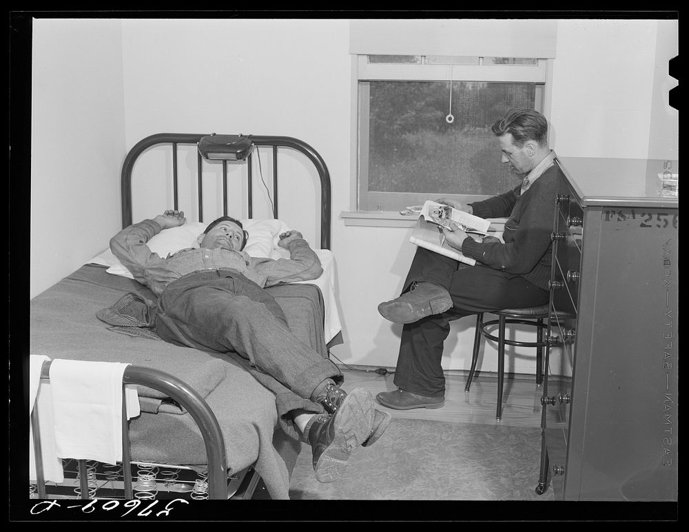 Workers from electric boat company plant relaxing in single room of new dormitories for defense workers. Groton…
