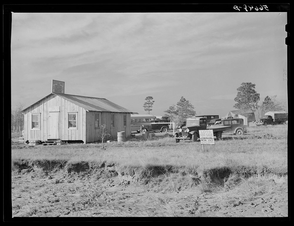 New cafe with trailers and tents in the rear near Forrest Hill. Lots are for sale everywhere and land near Camp Claiborne…