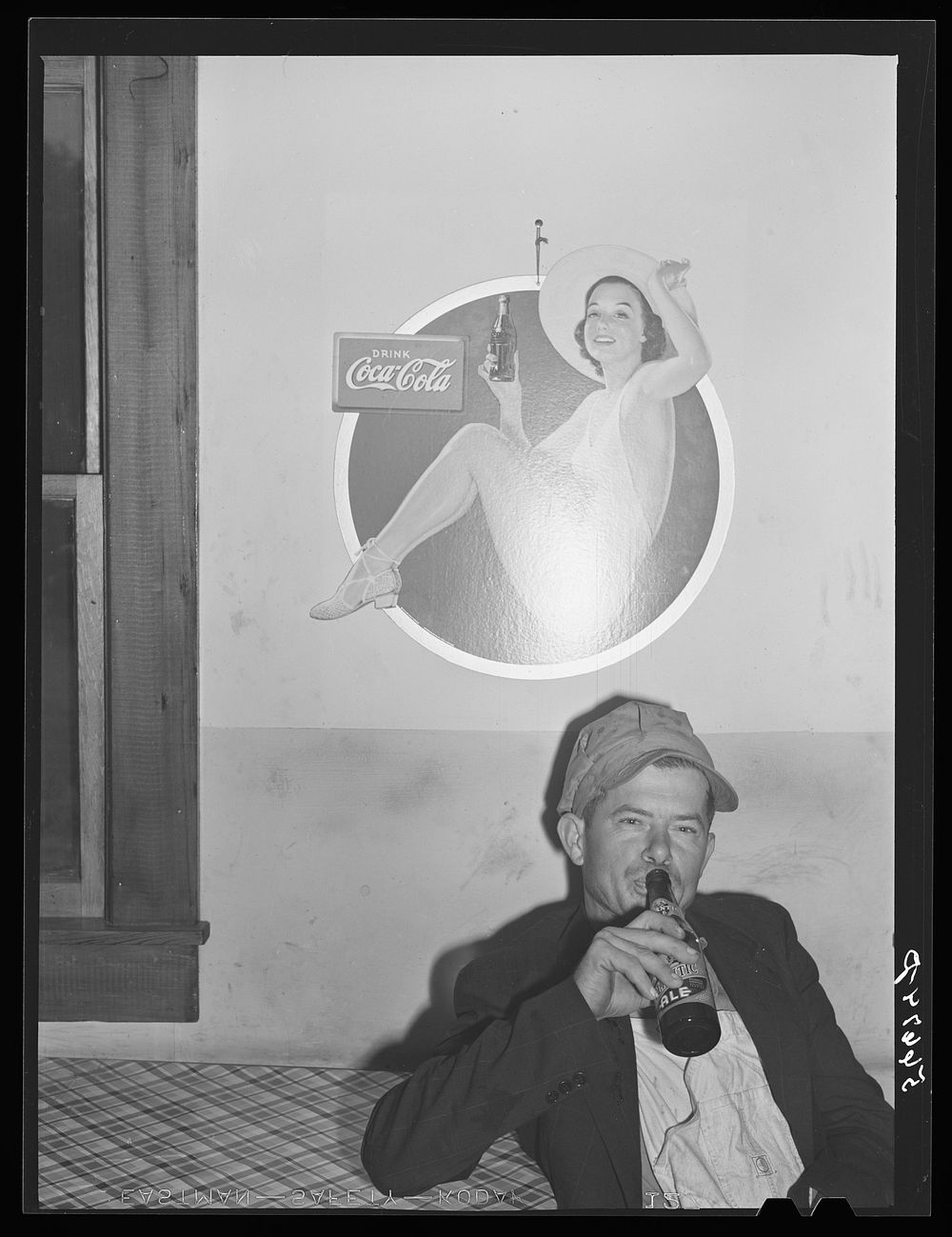 Finnish construction worker from New York drinking beer while spending his leisure time in a cafe near Camp Blanding. He was…