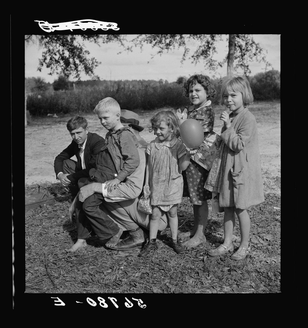 Family of construction worker who had been employed on Camp Blanding job. Starke, Florida. Sourced from the Library of…
