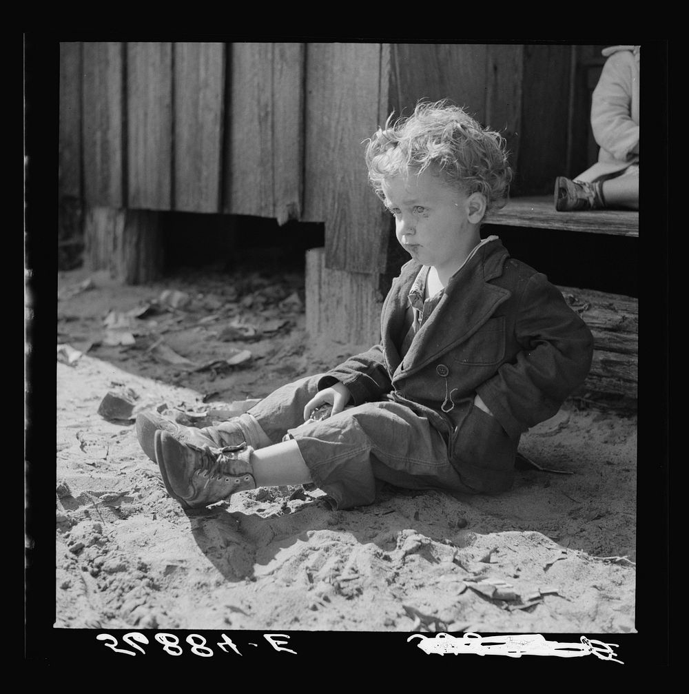 Child of construction worker who had been employed on Camp Blanding job. Starke, Florida. Sourced from the Library of…