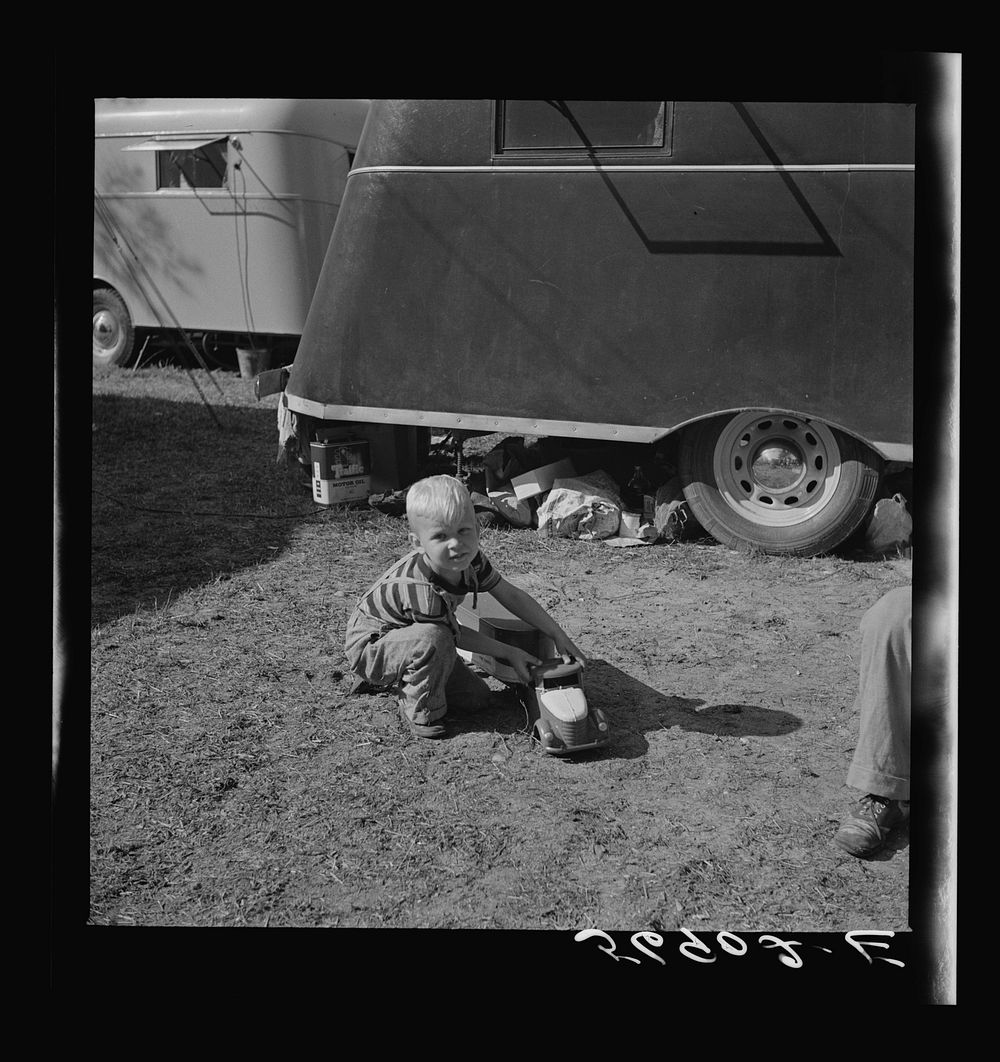 Playing outside trailer home. Sarasota trailer park, Sarasota, Florida. Sourced from the Library of Congress.