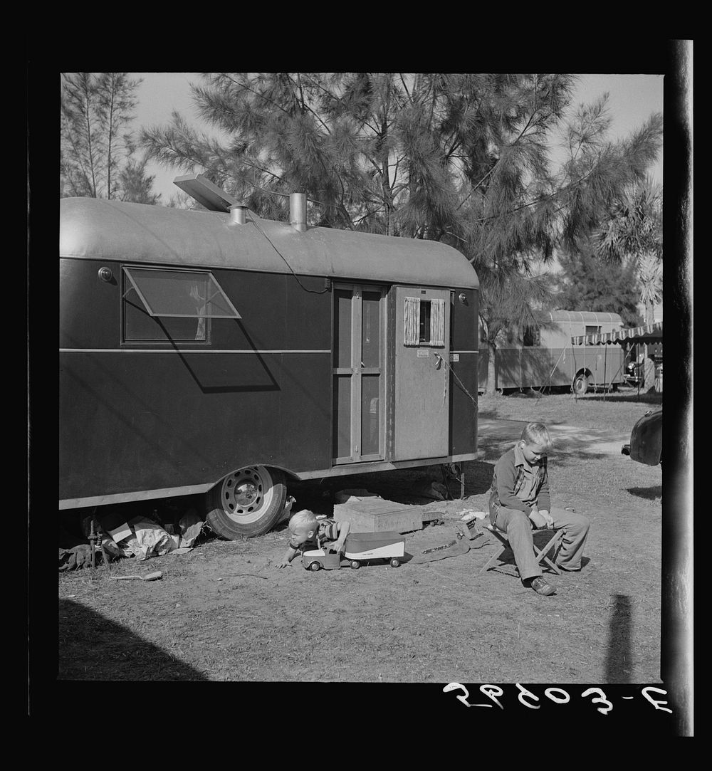[Untitled photo, possibly related to: Playing outside trailer home. Sarasota trailer park, Sarasota, Florida]. Sourced from…