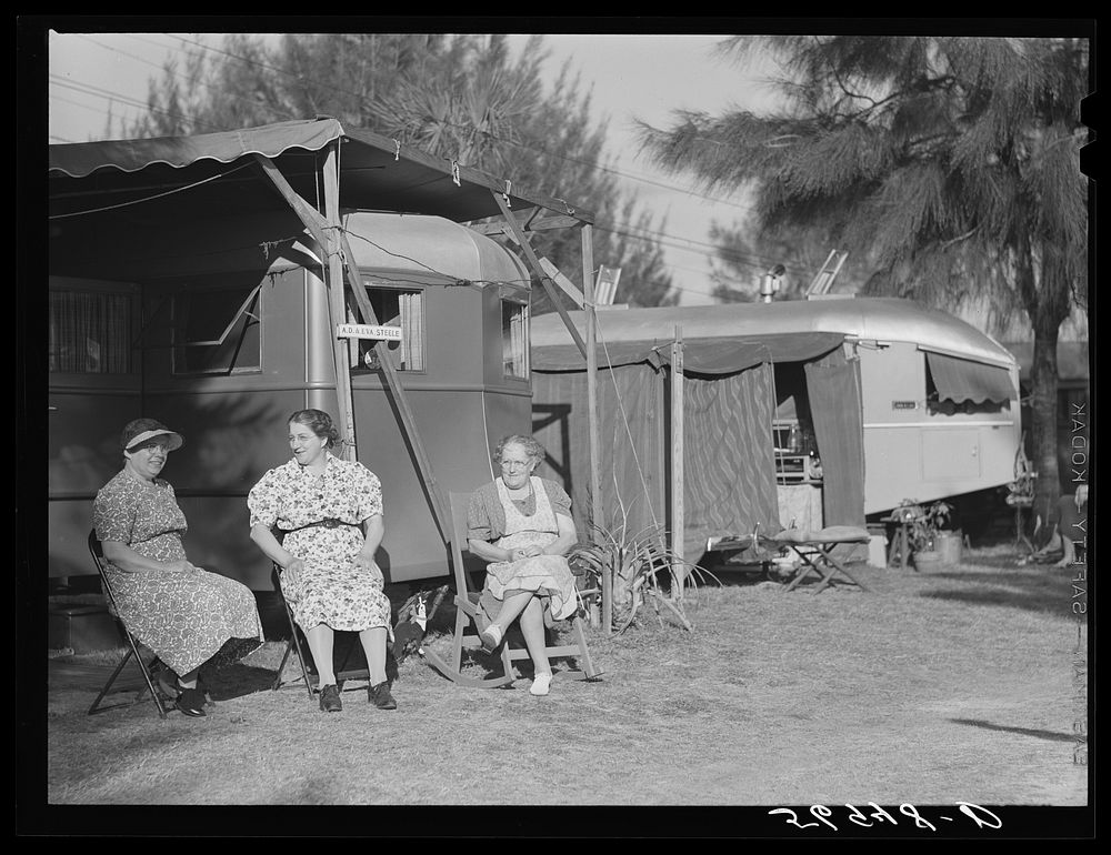 Sitting outside trailer in Sarasota trailer park. Sarasota, Florida. Sourced from the Library of Congress.