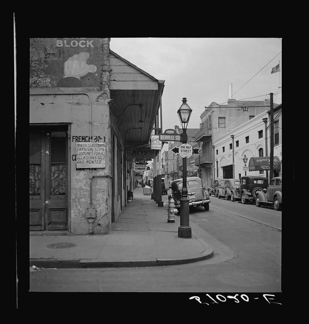 Sign on shop advertising costumes for Mardi Gras. New Orleans, Louisiana. Sourced from the Library of Congress.