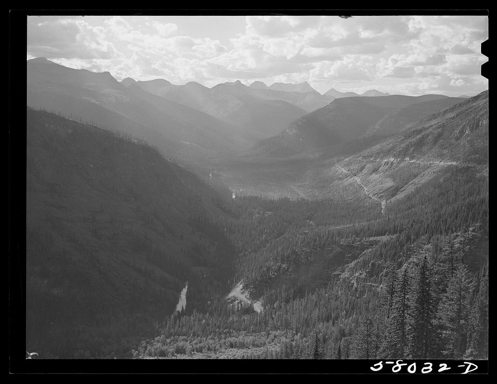 General view of Rocky Mountains west of Continental Divide seen from top of Logan Pass on Going-to-the-Sun highway. Glacier…