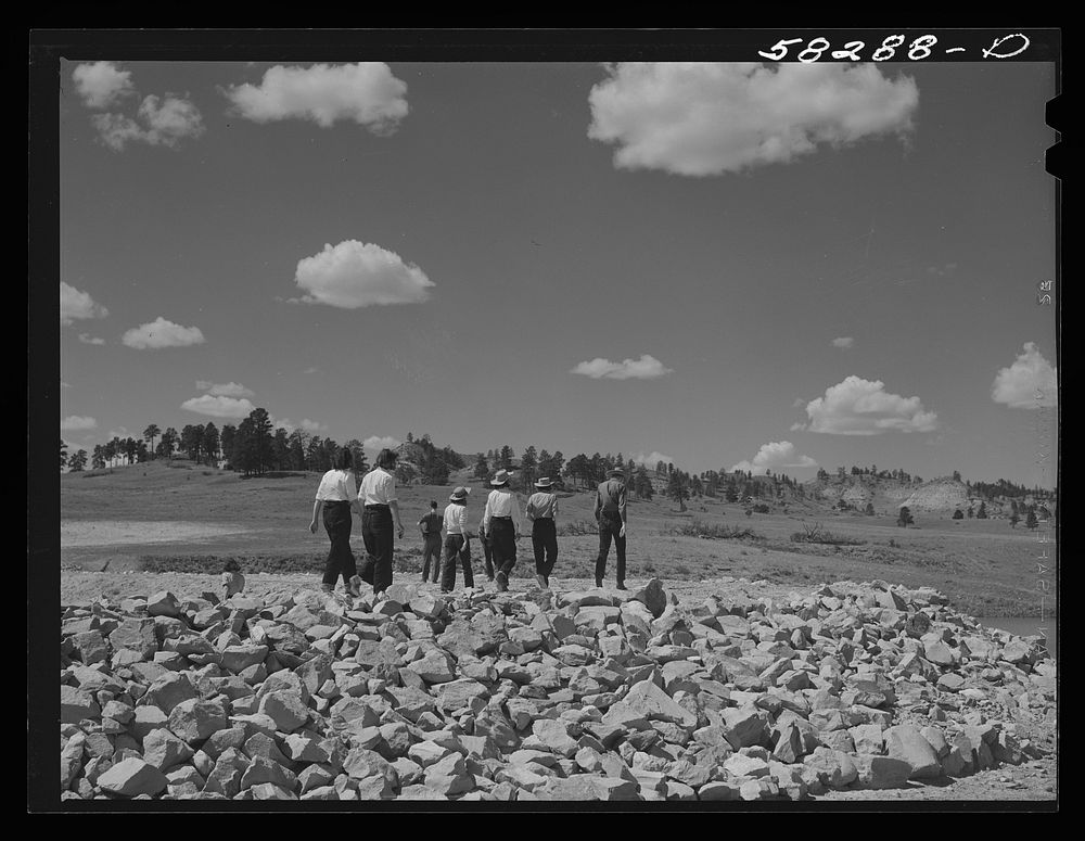 Dudes from Quarter Circle U Ranch seeing the reservoir for cattle on Lyman Brewster's lease. Near Lame Deer, Montana.…