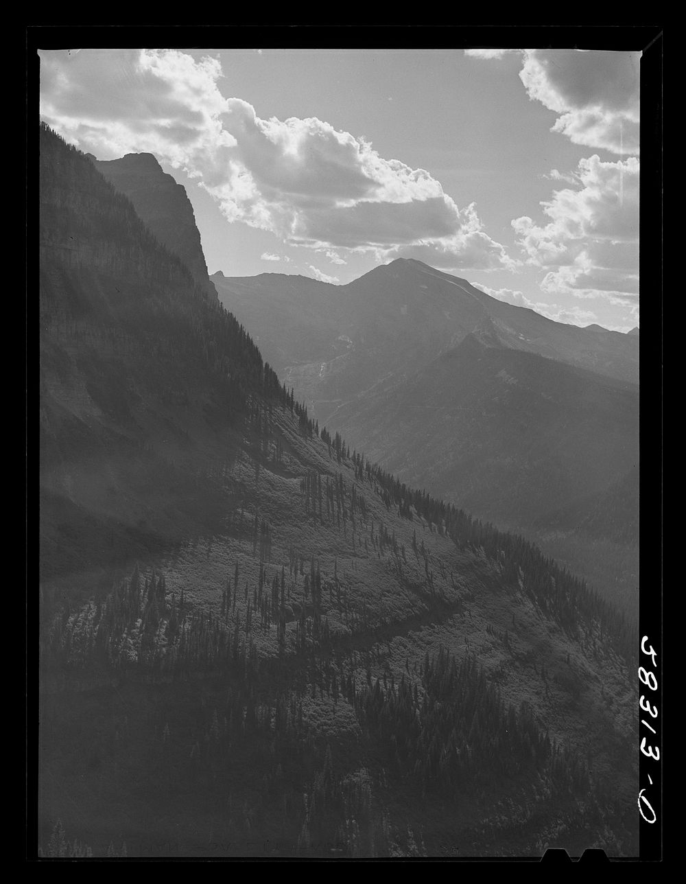 General view of Rocky Mountains west of Continental Divide seen from top of Logan Pass en route to the Sun highway. Glacier…