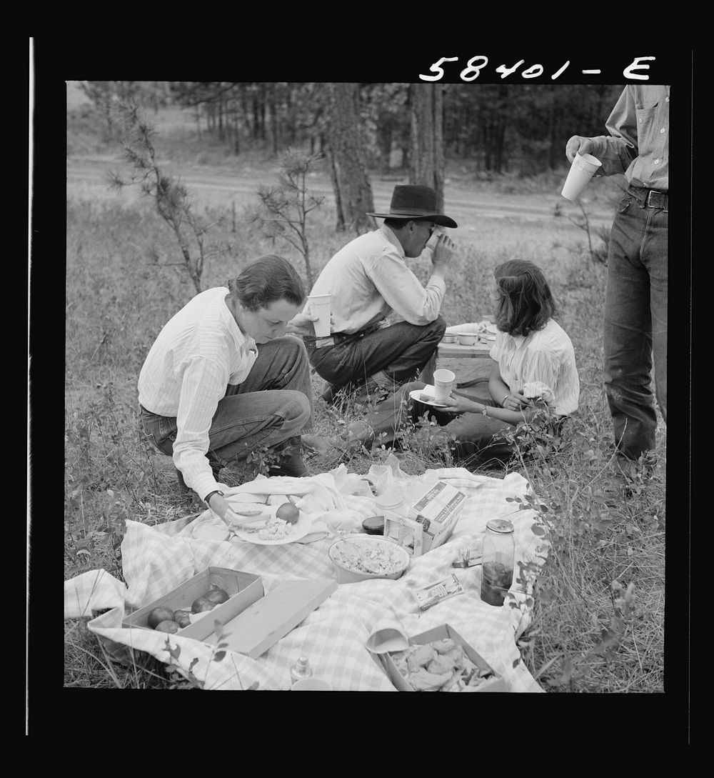 Mrs. Lyman Brewster with some dudes on a picnic on the Brewster-Arnold lease. Near Lame Deer, Montana. Sourced from the…