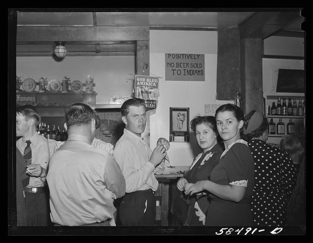 Birney, Montana. People who came to a Saturday night dance around the bar. Sourced from the Library of Congress.