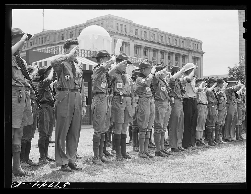 Boy scouts saluting the flag in the Commerce Square, Washington, D.C.. Sourced from the Library of Congress.