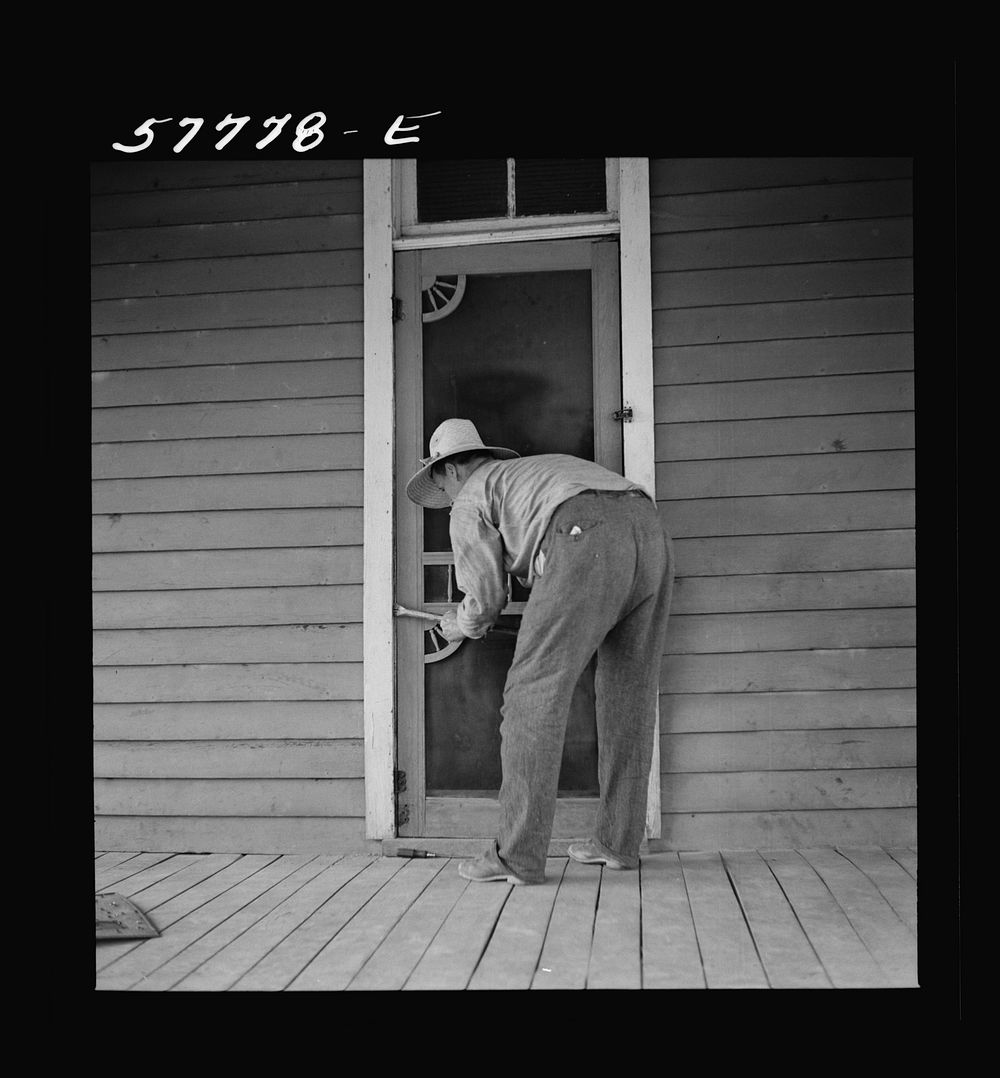 Removing the old worn-out door. Screen door construction demonstration. Charles County, La Plata, Maryland. Sourced from the…