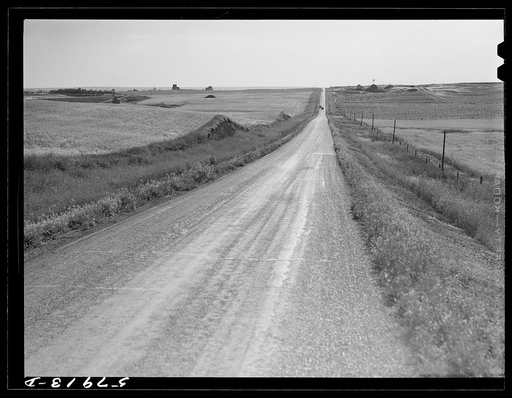 Highway through wheat ranches near Williston, North Dakota. Sourced from the Library of Congress.