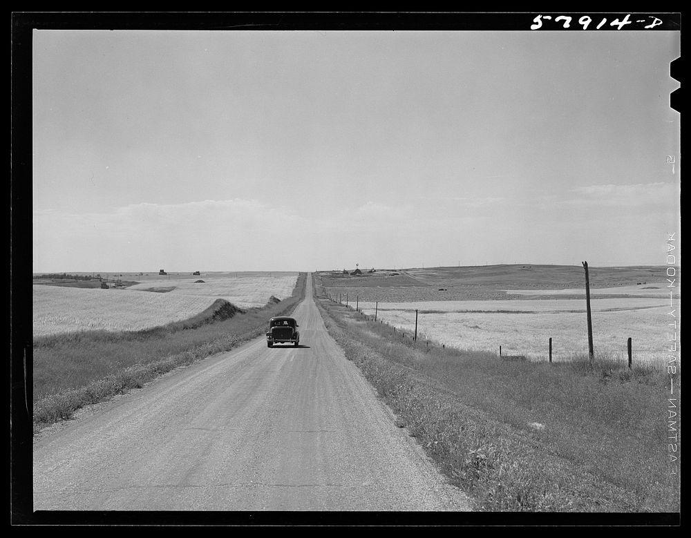 [Untitled photo, possibly related to: Highway through wheat ranches near Williston, North Dakota]. Sourced from the Library…