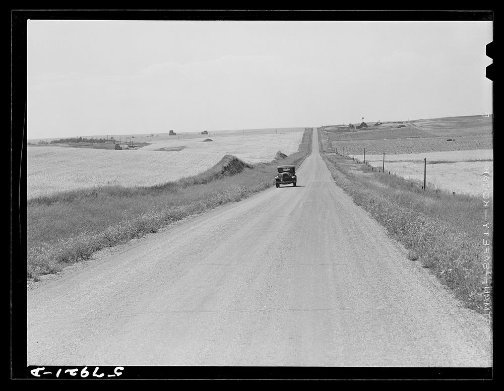 Highway through wheat ranches near Williston, North Dakota. Sourced from the Library of Congress.