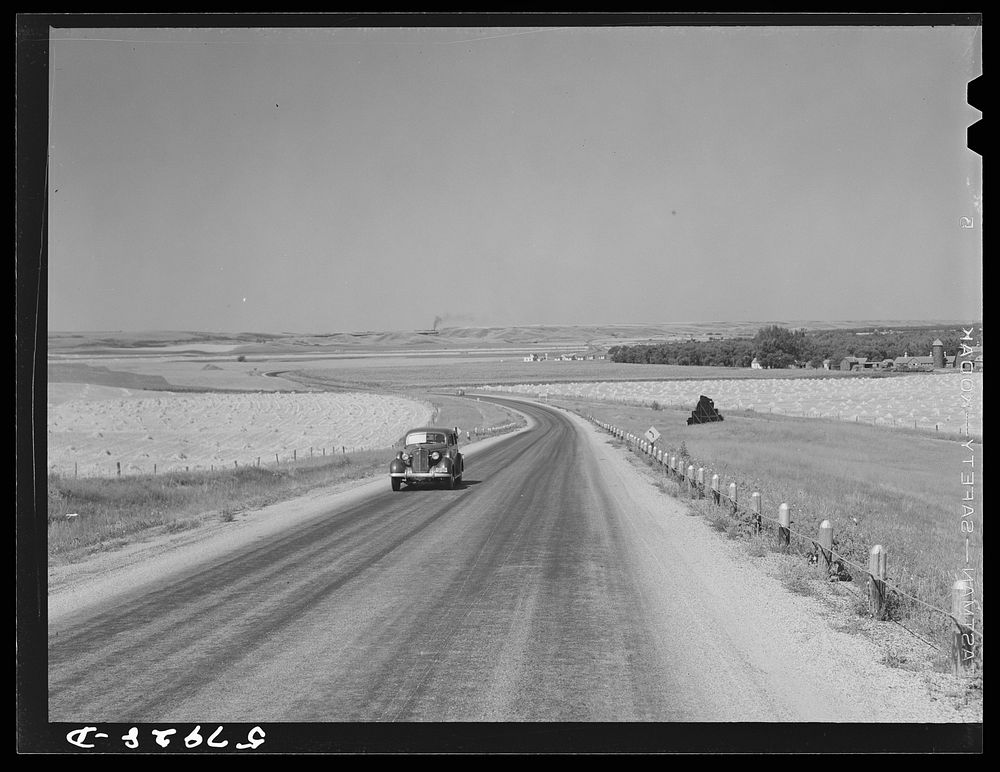 Highway and wheat fields near Minot, North Dakota. Sourced from the Library of Congress.