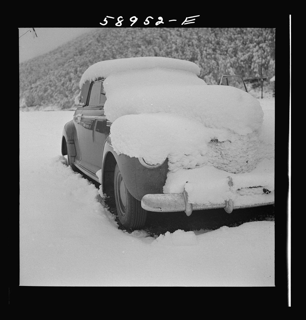 [Untitled photo, possibly related to: Car covered with snow after early fall blizzard on ranch in mountains rear Aspen…