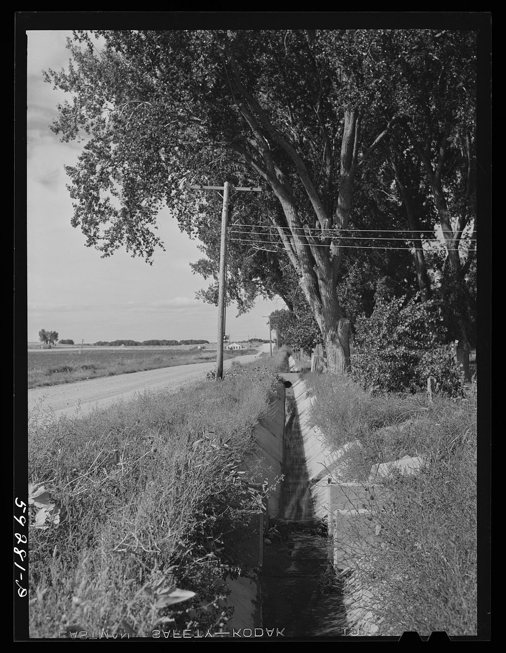 [Untitled photo, possibly related to: Irrigation ditch on Scottsbluff Farmsteads, FSA (Farm Security Administration)…
