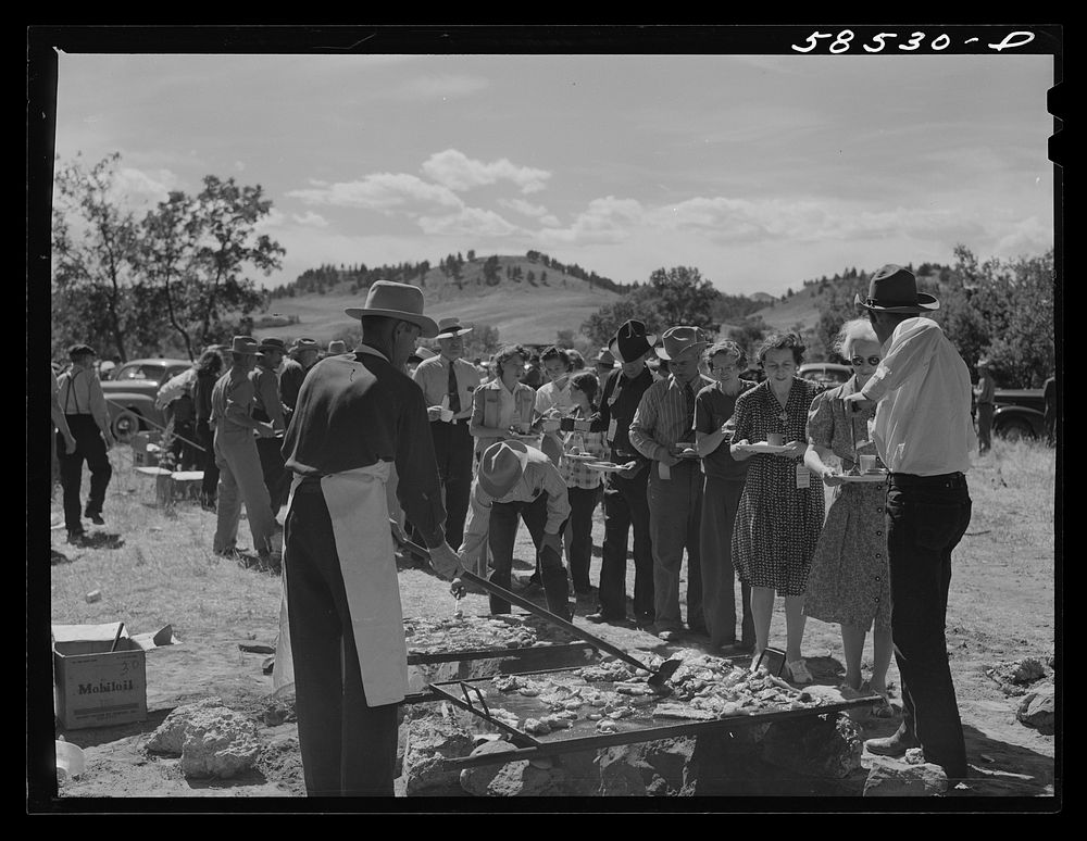 Barbecuing beef at the stockmen's picnic and barbecue. Spears Siding, Wyola, Montana. Sourced from the Library of Congress.