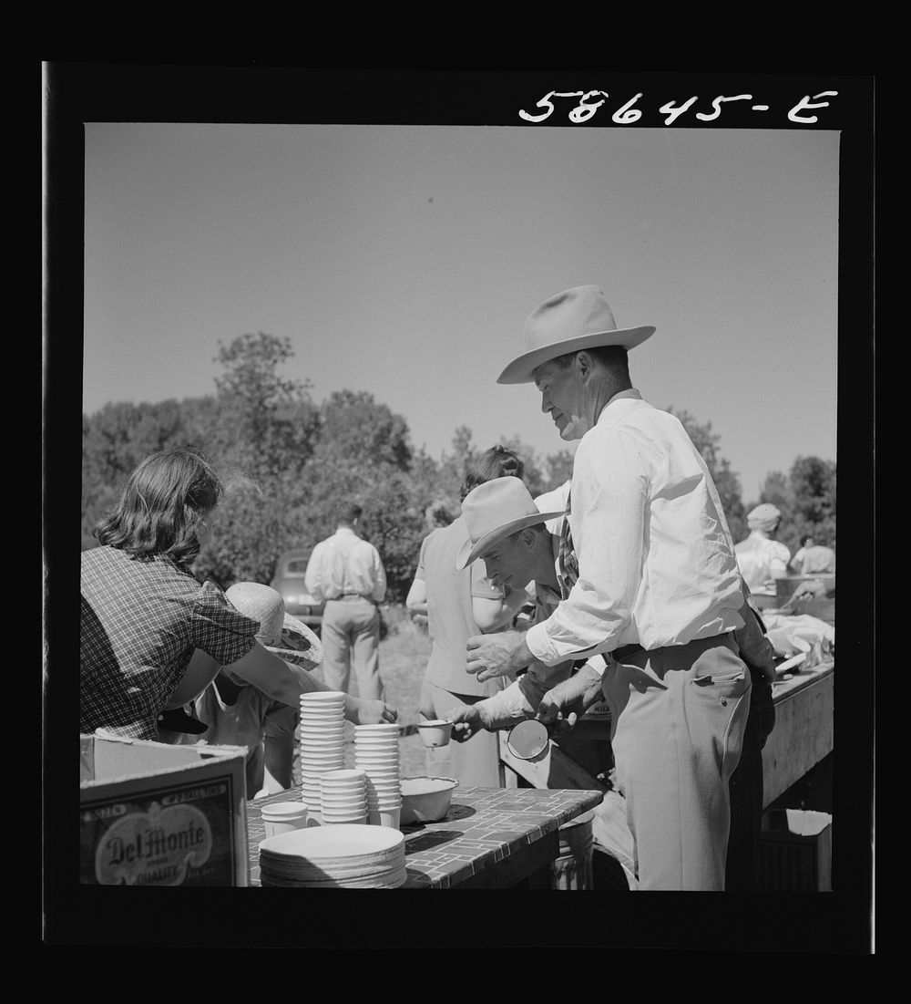 Waiting in line for barbecued beef at the stockmen's picnic and barbecue. Spear's Siding, Wyola, Montana. Sourced from the…