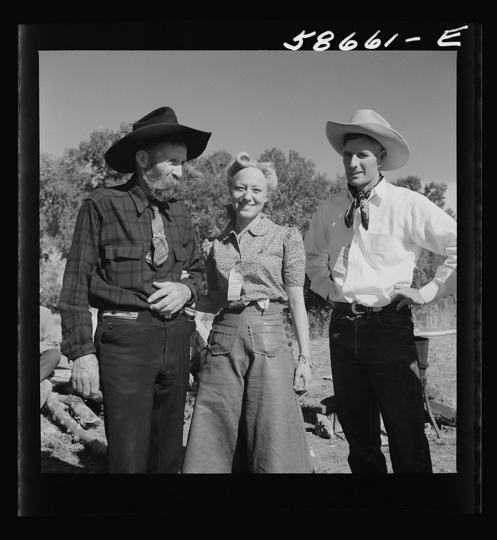Spear's Siding, Wyola, Montana. Lyman Brewster of Quarter Circle U Ranch with Sally Rand and her father, Turk Greenough, at…
