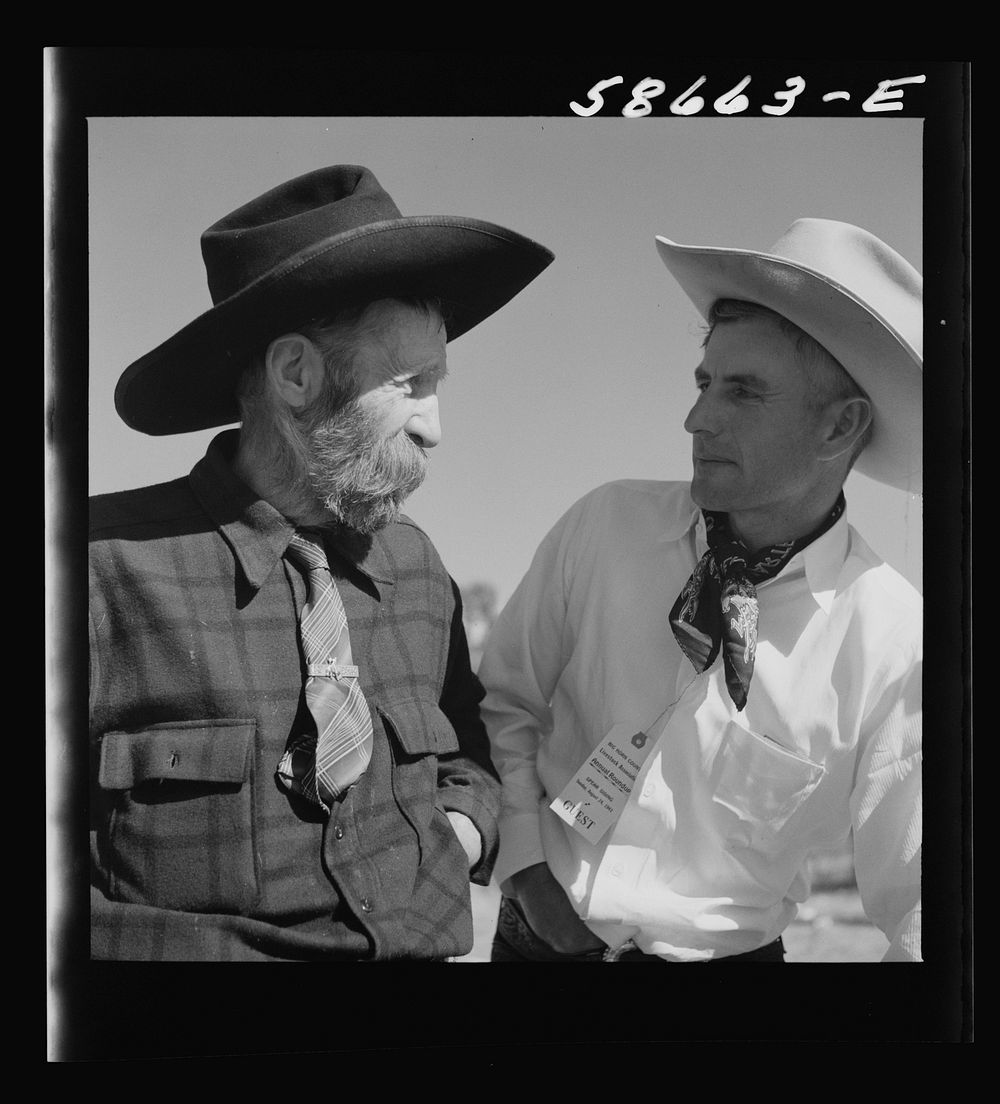 Lyman Brewster of Quarter Circle U Ranch with Turk Greenough's father (Sally Rand's father-in-law) at a stockmen's picnic…