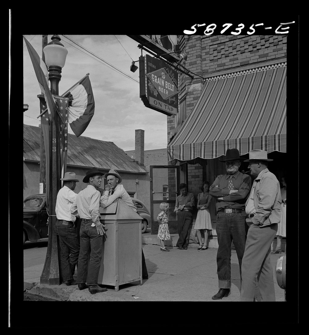 [Untitled photo, possibly related to: Stockmen on street corner. Sheridan, Wyoming]. Sourced from the Library of Congress.