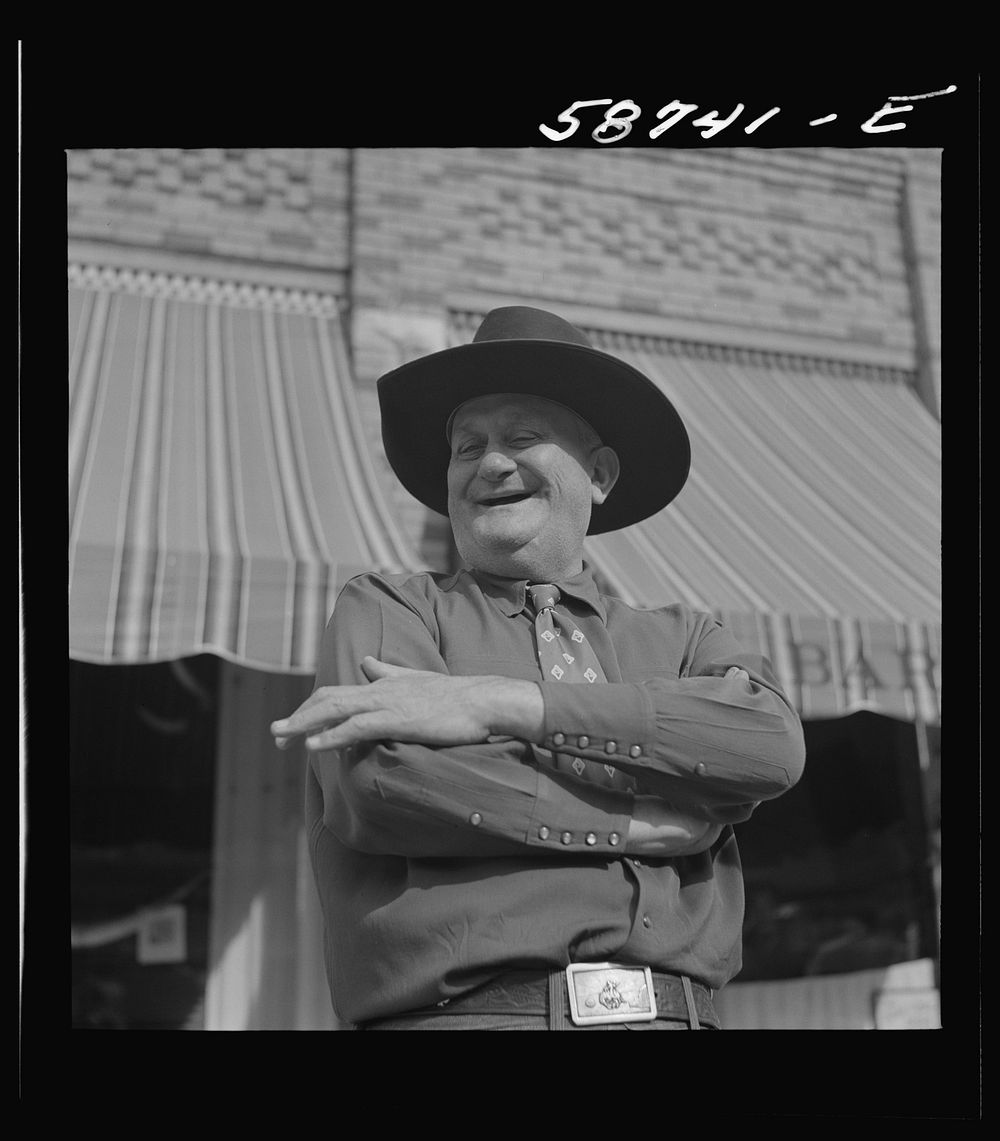 Stockman on street corner. Sheridan, Wyoming. Sourced from the Library of Congress.