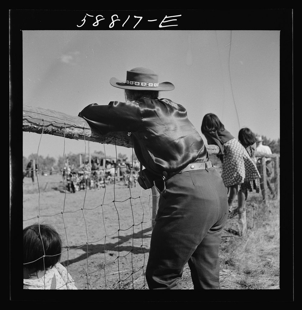 Dude watching the Indian dance at annual fair. Crow Agency, Montana. Sourced from the Library of Congress.