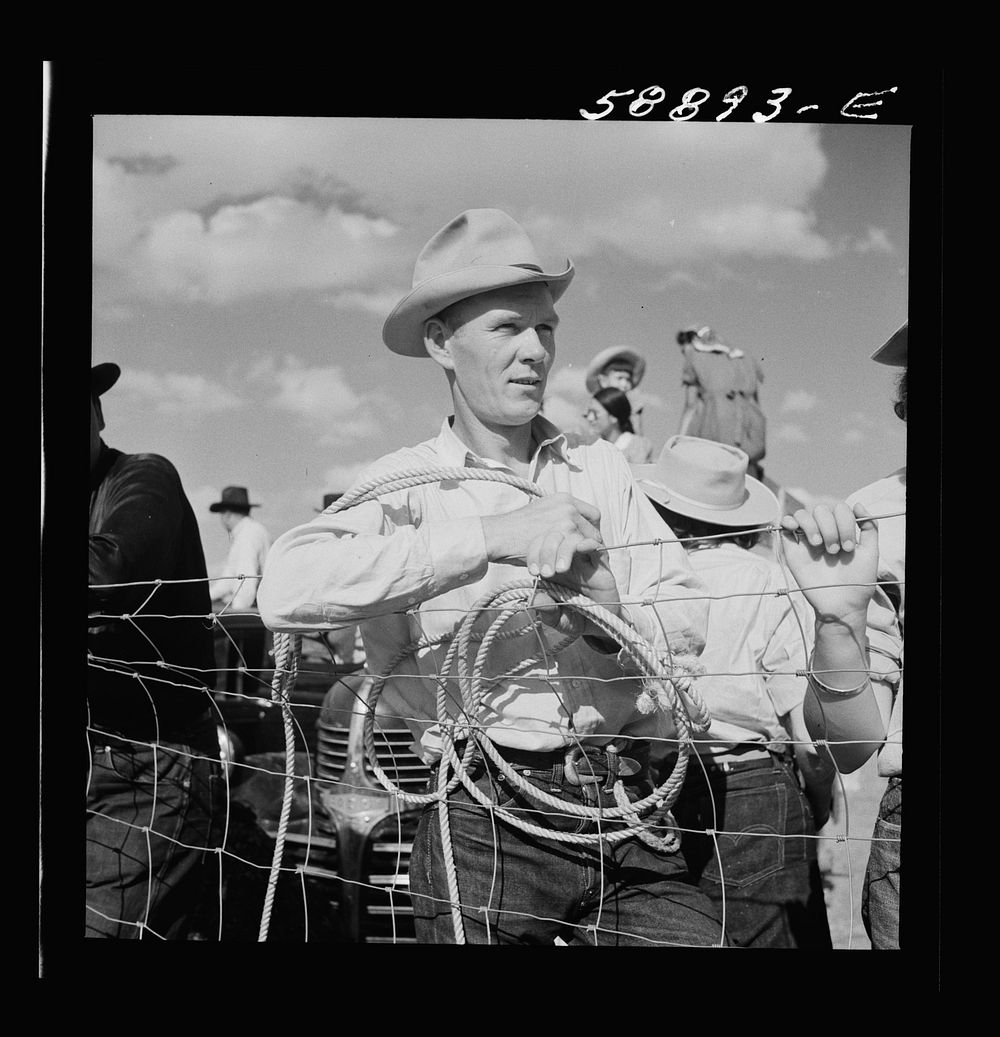 Cowboy from Quarter Circle U Ranch at Crow Indian fair. Crow Agency, Montana. Sourced from the Library of Congress.