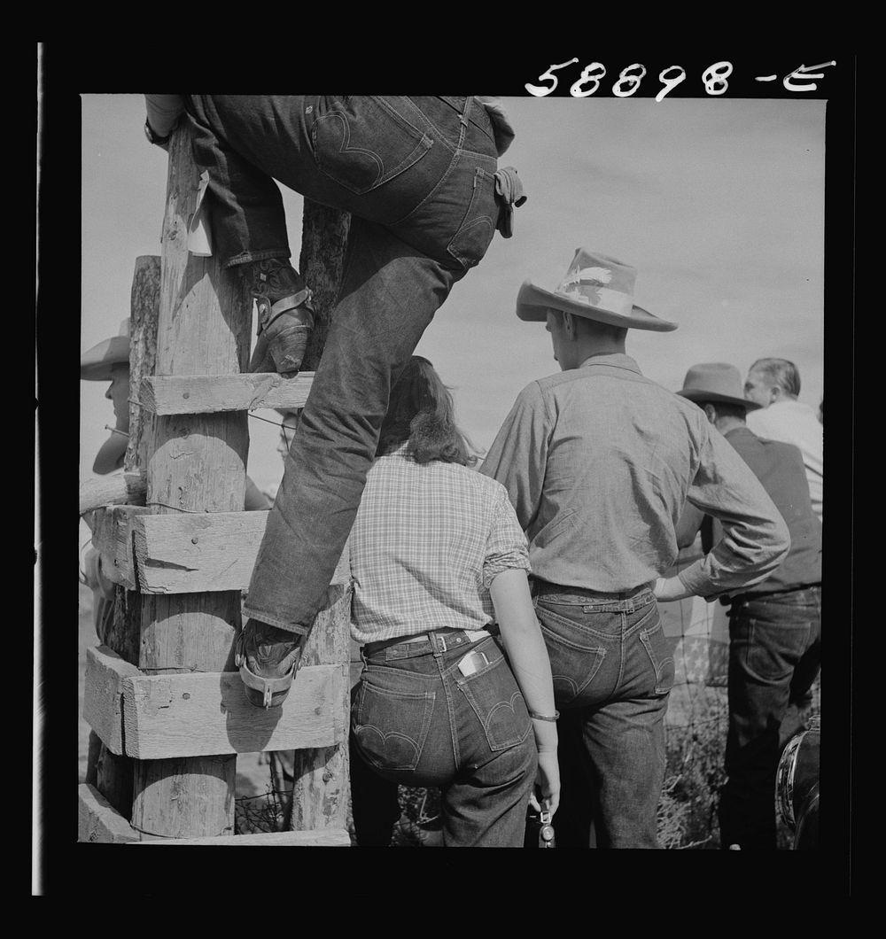 Dudes and cowboy from Quarter Circle U Ranch at Crow Indian fair. Crow Agency, Montana. Sourced from the Library of Congress.