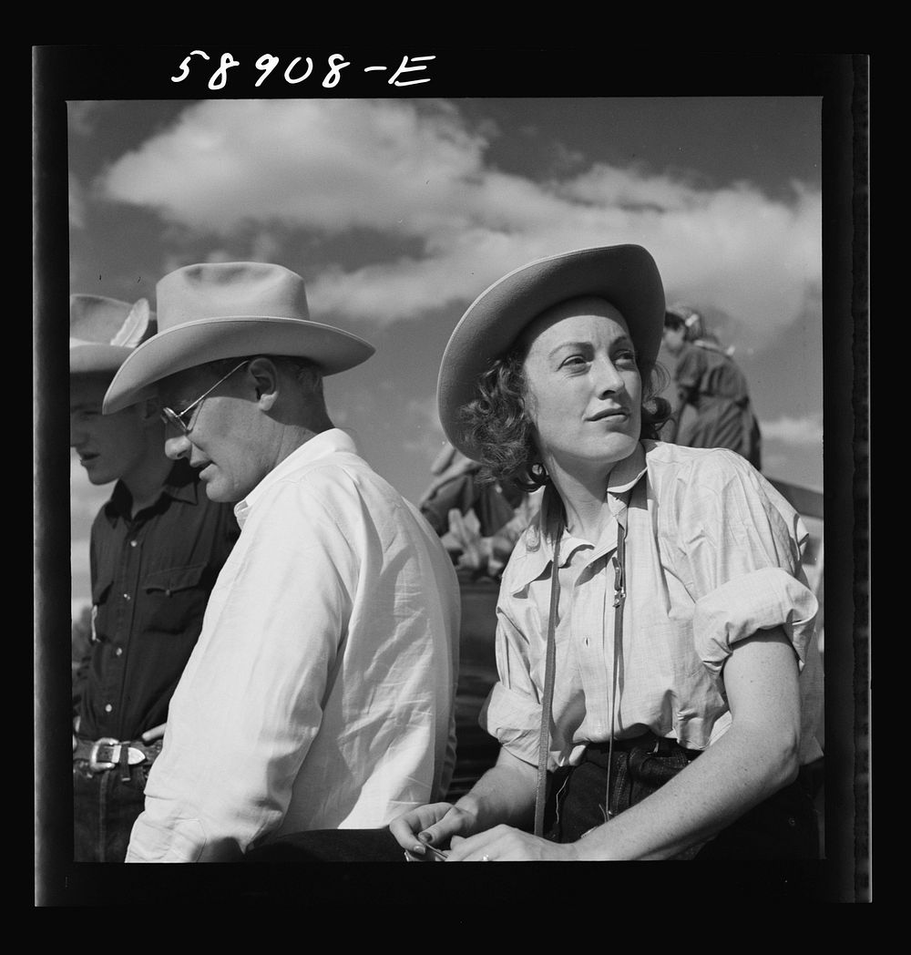 [Untitled photo, possibly related to: Dudes from Quarter Circle U Ranch watching the rodeo at the Crow Indian fair. Crow…
