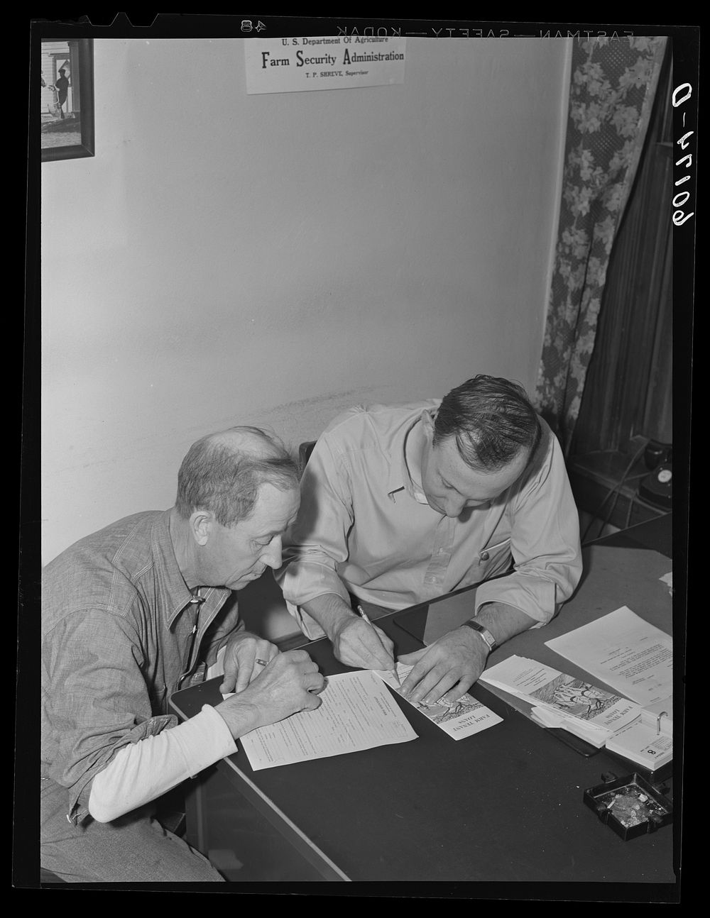 Scene in FSA (Farm Security Administration) county supervisor's office. Grant County, Wisconsin. Sourced from the Library of…