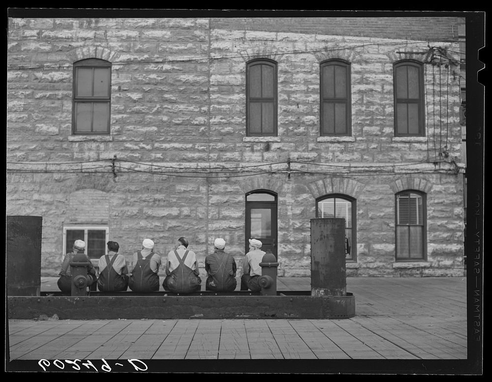 Flour mill employees at noon hour. Minneapolis, Minnesota. Sourced from the Library of Congress.