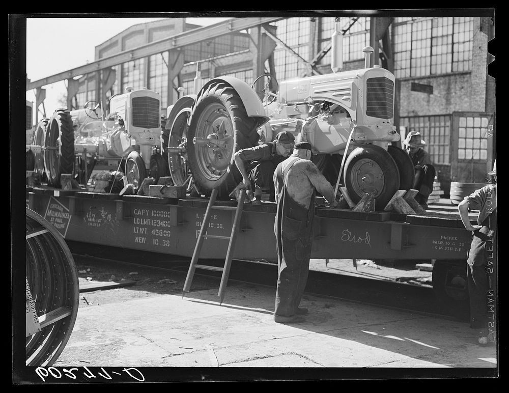 Loading tractors onto railroad car. Minneapolis-Moline Company. Minneapolis, Minnesota. Sourced from the Library of Congress.