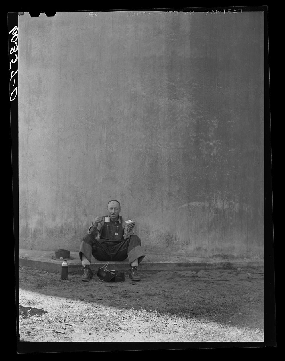 Grain elevator employee at lunch. Minneapolis, Minnesota. Sourced from the Library of Congress.
