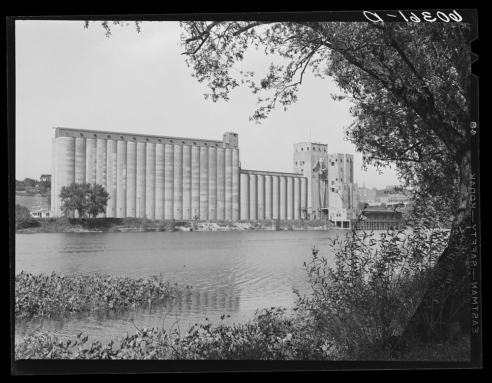 [Untitled photo, possibly related to: Grain elevators along Mississippi River. Saint Paul, Minnesota]. Sourced from the…