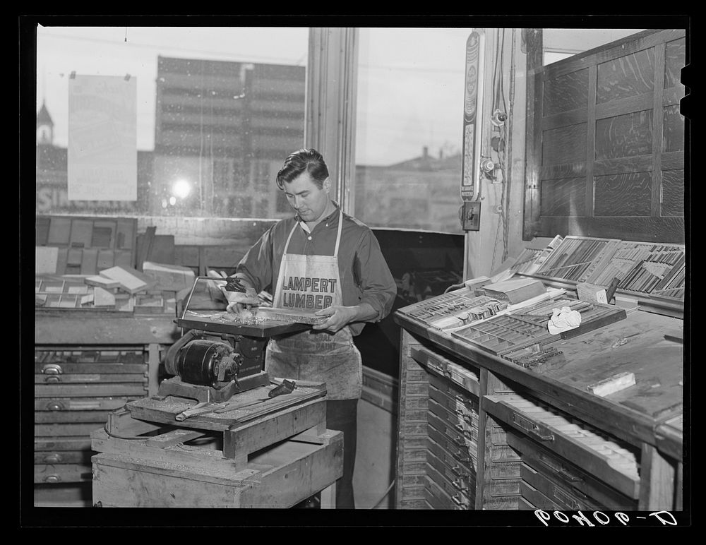 Sawing lead blocks for making cuts. Office of the Valley News. Browns Valley, Minnesota. Sourced from the Library of…