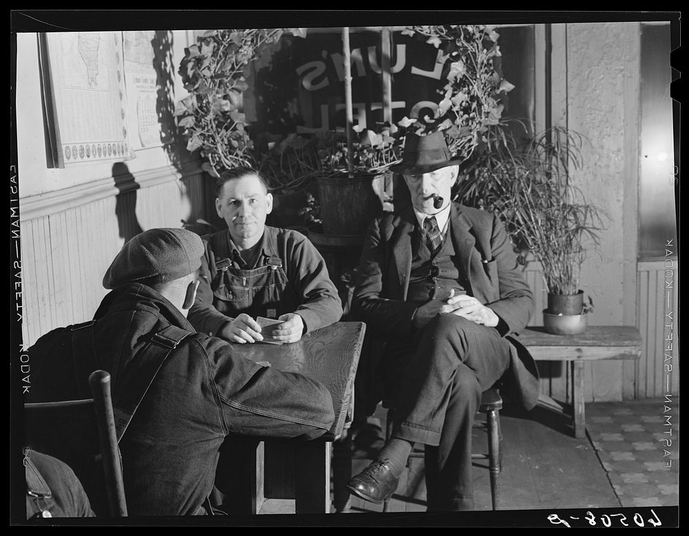 [Untitled photo, possibly related to: Men in lobby of thirty-five cents hotel. Dubuque, Iowa]. Sourced from the Library of…