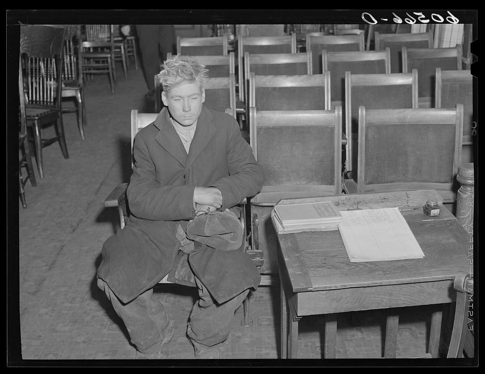Young boy waiting to see if he can get a place to sleep for the night. City mission, Dubuque, Iowa. Sourced from the Library…
