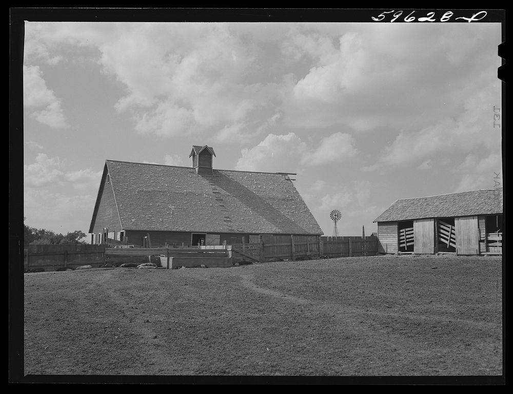 Barn and feeding pens and troughs on Tom Reed farm. Lexington, Nebraska. Sourced from the Library of Congress.