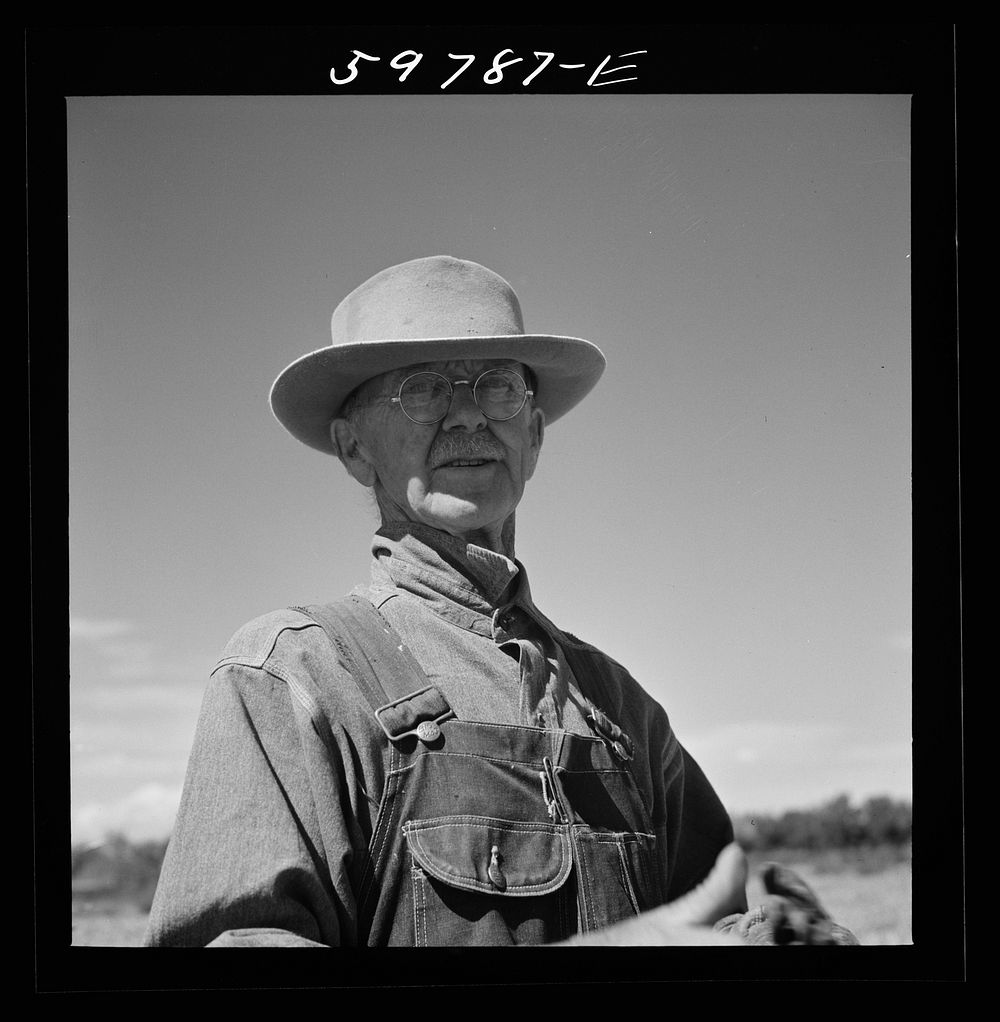 A.E. Scott on his farm northeast of Scottsbluff, Nebraska. See general caption number one. Sourced from the Library of…