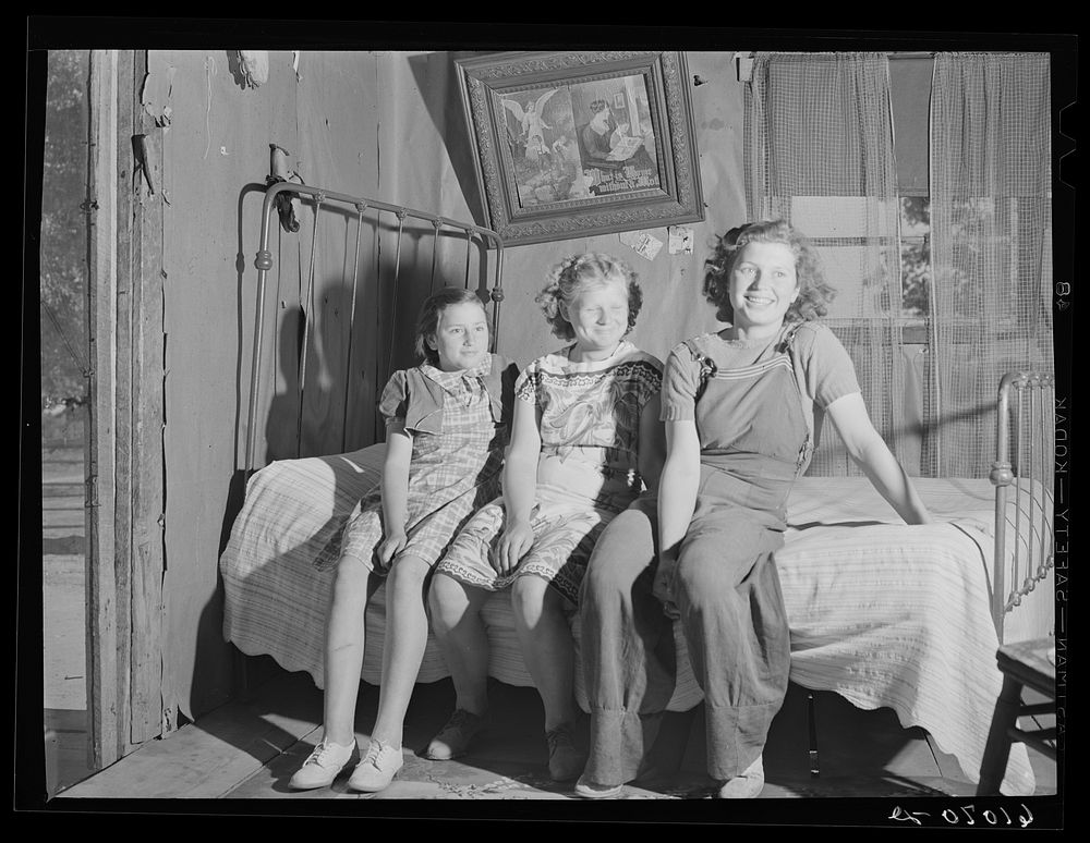 Daughters of farmer living on sub-marginal land along Mississippi riverbottoms. The family will move to one of the new Delmo…
