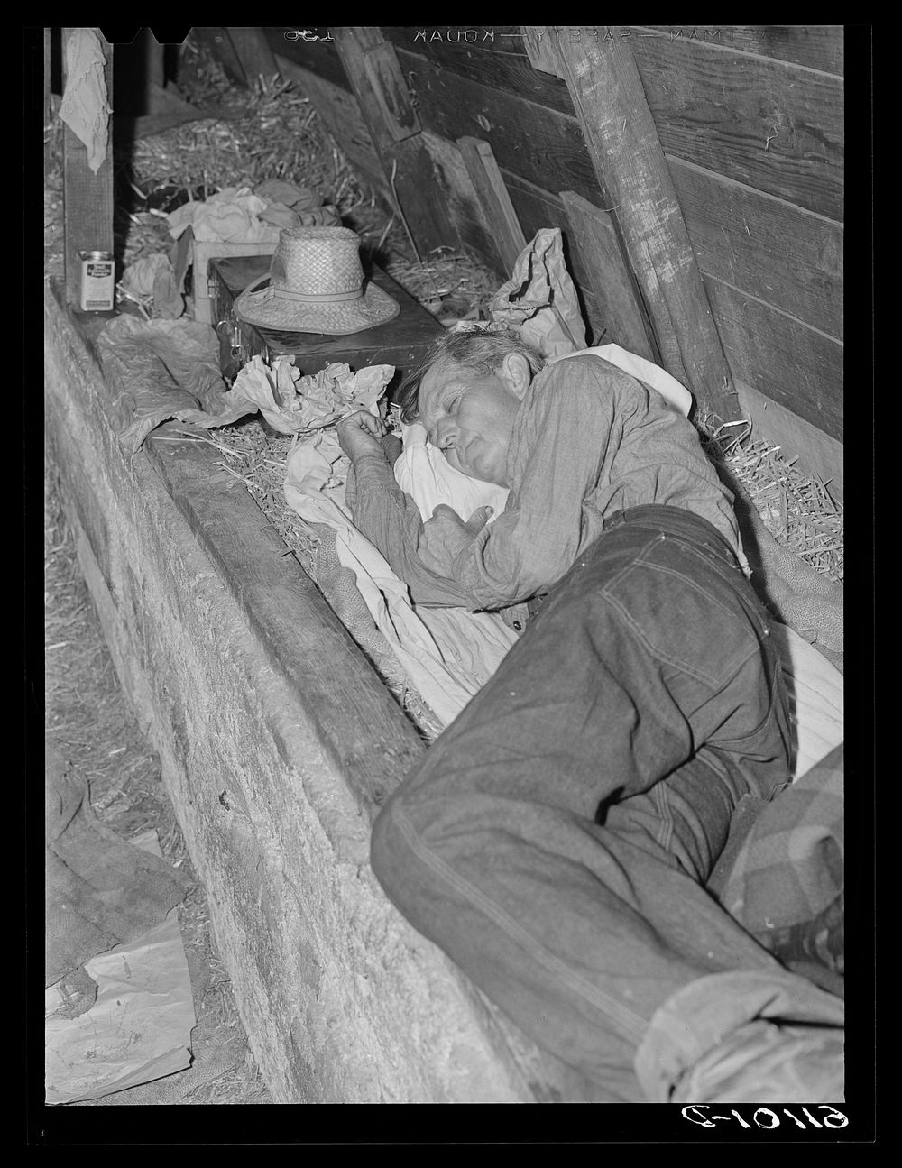 Sleeping quarters in old barn occupied by migrant fruit workers. Berrien County, Michigan. Sourced from the Library of…